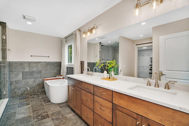 20111 N Woodland Cir, Mokena, IL 60448 - full bath with tile walls, double vanity, a soaking tub, a shower stall, and a wainscoted wall