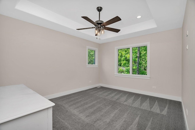 20111 N Woodland Cir, Mokena, IL 60448 - empty room with ceiling fan, a tray ceiling, dark carpet, and recessed lighting