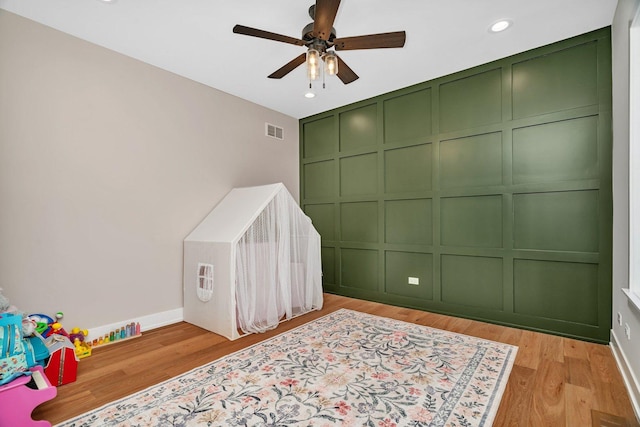 20111 N Woodland Cir, Mokena, IL 60448 - bedroom with a decorative wall, recessed lighting, light wood-style floors, and ceiling fan