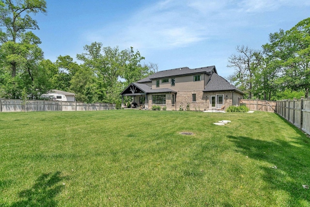 20111 N Woodland Cir, Mokena, IL 60448 - rear view of property featuring a fenced backyard, brick siding, a gazebo, and a patio area