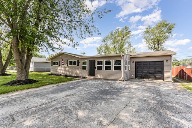 1220 Highland Ave, Lockport, IL 60441 - ranch-style home with asphalt driveway and a garage