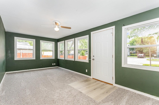 1220 Highland Ave, Lockport, IL 60441 - unfurnished sunroom featuring healthy amount of natural light, baseboards, and carpet floors