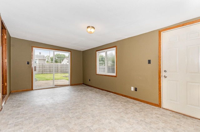 1220 Highland Ave, Lockport, IL 60441 - spare room featuring baseboards and lofted ceiling