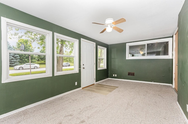 1220 Highland Ave, Lockport, IL 60441 - entrance foyer featuring a ceiling fan, carpet floors, and baseboards
