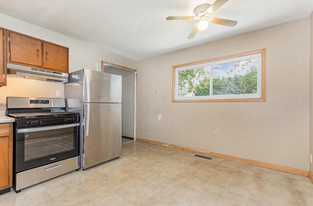1220 Highland Ave, Lockport, IL 60441 - kitchen with appliances with stainless steel finishes, under cabinet range hood, brown cabinets, a ceiling fan, and light floors