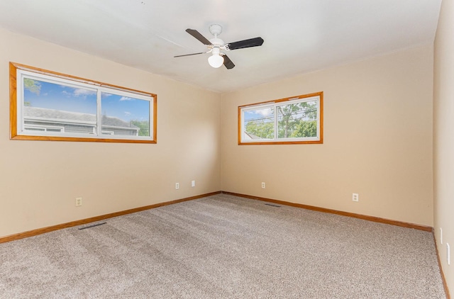 1220 Highland Ave, Lockport, IL 60441 - unfurnished room with carpet flooring, baseboards, and a ceiling fan