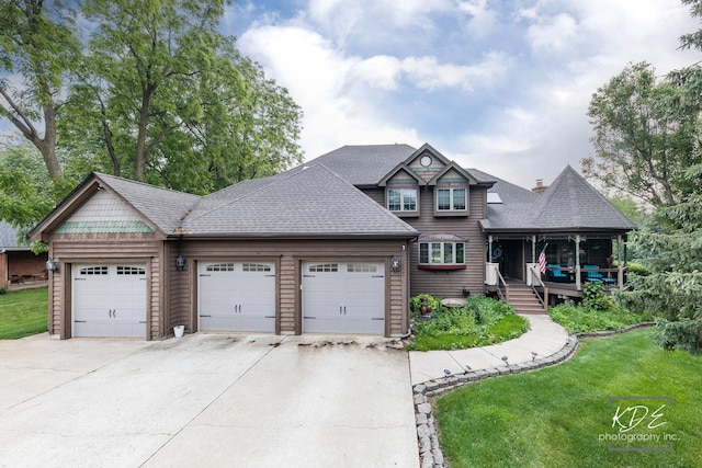 645 Saint Christopher Ct, Aurora, IL 60506 - view of front of property featuring a front yard, driveway, a garage, roof with shingles, and covered porch