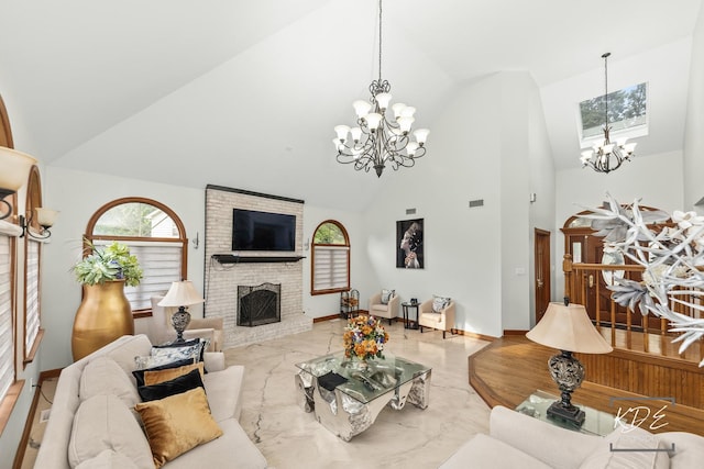 645 Saint Christopher Ct, Aurora, IL 60506 - living room featuring a chandelier, high vaulted ceiling, marble tiled floors, and a fireplace