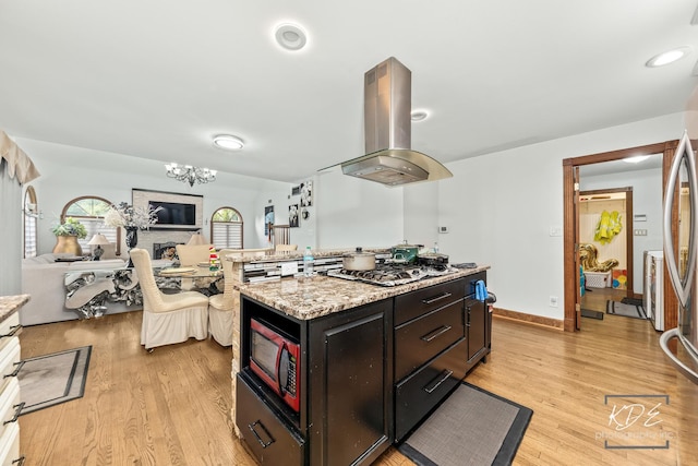 645 Saint Christopher Ct, Aurora, IL 60506 - kitchen with island range hood, stainless steel appliances, light wood-type flooring, and a kitchen island