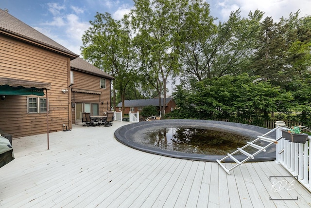 645 Saint Christopher Ct, Aurora, IL 60506 - wooden terrace with outdoor dining space