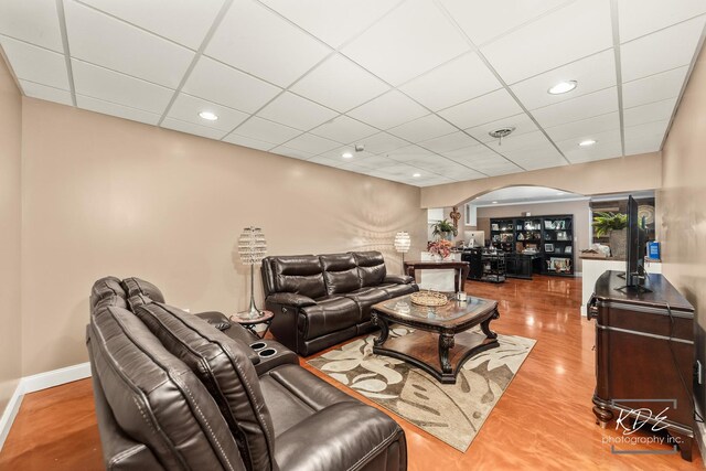 645 Saint Christopher Ct, Aurora, IL 60506 - living room featuring arched walkways, a drop ceiling, and recessed lighting