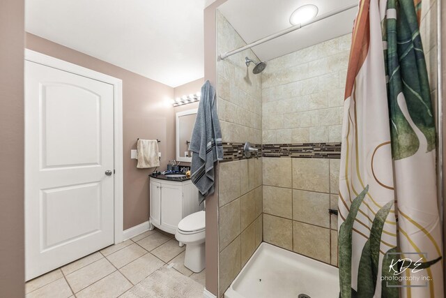 645 Saint Christopher Ct, Aurora, IL 60506 - bathroom with tile patterned flooring, tiled shower, and vanity