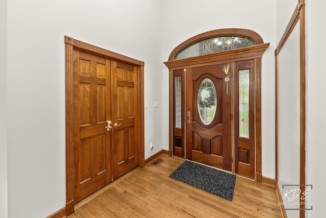645 Saint Christopher Ct, Aurora, IL 60506 - entrance foyer with light wood-style flooring and a towering ceiling
