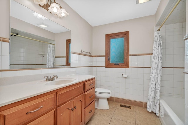 8932 Pebble Beach Ln, Orland Park, IL 60462 - full bath with vanity, tile patterned floors, tile walls, shower / bath combo, and wainscoting