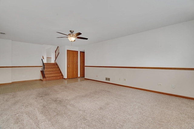 8932 Pebble Beach Ln, Orland Park, IL 60462 - empty room with stairs, ceiling fan, and carpet floors