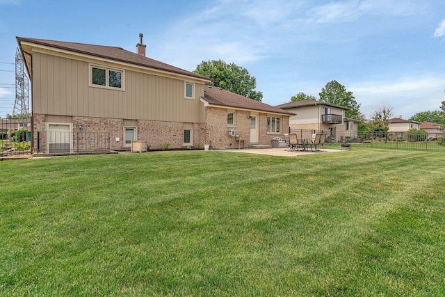 8932 Pebble Beach Ln, Orland Park, IL 60462 - back of property with brick siding, a patio area, and roof with shingles
