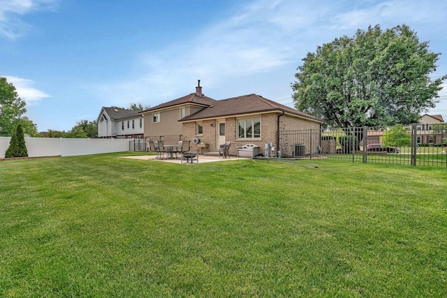 8932 Pebble Beach Ln, Orland Park, IL 60462 - back of property featuring a patio, brick siding, and a chimney