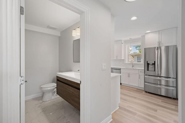 7810 N Neva Ave, Niles, IL 60714 - full bath with two vanities and recessed lighting