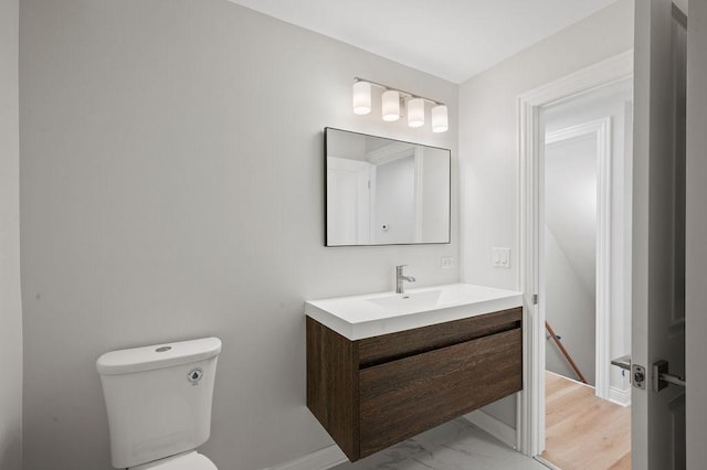 7810 N Neva Ave, Niles, IL 60714 - half bathroom featuring vanity and marble finish flooring