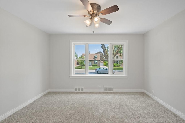 7810 N Neva Ave, Niles, IL 60714 - unfurnished room with light carpet and a ceiling fan