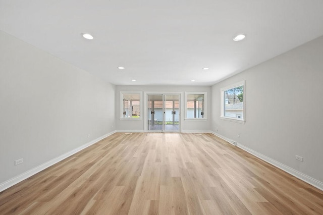 7810 N Neva Ave, Niles, IL 60714 - unfurnished living room featuring recessed lighting and light wood-type flooring