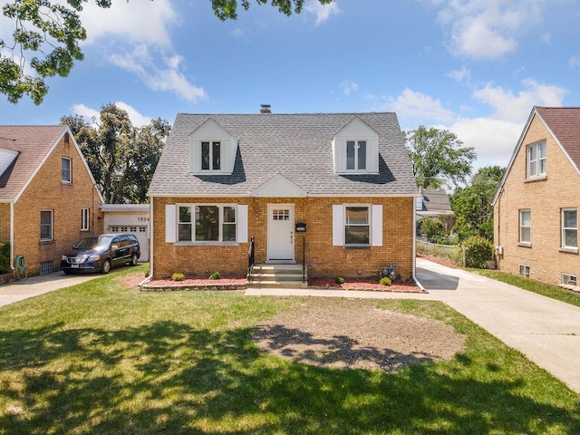 7810 N Neva Ave, Niles, IL 60714 - cape cod-style house with brick siding, a front yard, and roof with shingles