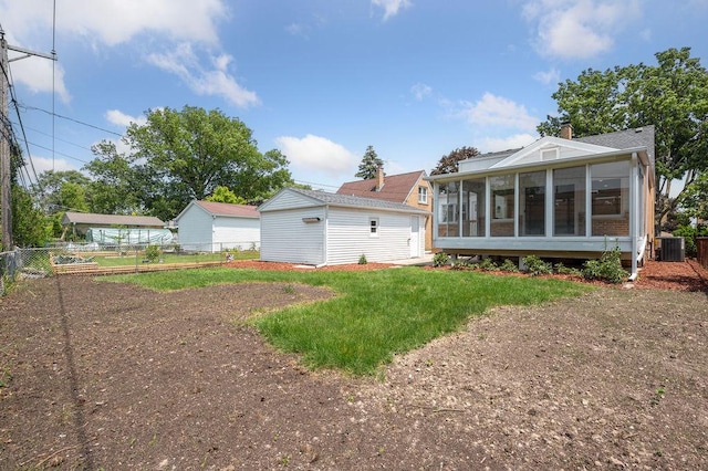 7810 N Neva Ave, Niles, IL 60714 - back of property with a sunroom and a chimney
