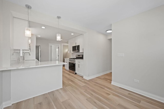 7810 N Neva Ave, Niles, IL 60714 - kitchen featuring stainless steel appliances, white cabinetry, light wood finished floors, and recessed lighting