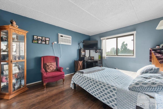 134 Klein Creek Ct Unit 4D, Carol Stream, IL 60188 - bedroom featuring a wall mounted AC, wood-type flooring, and a textured ceiling