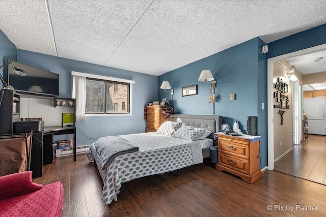 134 Klein Creek Ct Unit 4D, Carol Stream, IL 60188 - bedroom with a baseboard heating unit, wood finished floors, and a textured ceiling