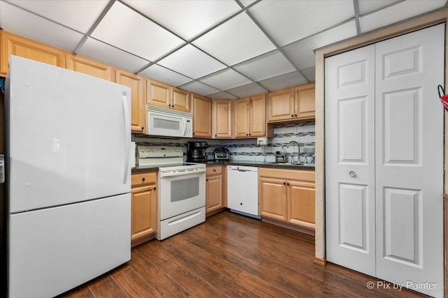 134 Klein Creek Ct Unit 4D, Carol Stream, IL 60188 - kitchen featuring white appliances, dark countertops, a drop ceiling, dark wood-style floors, and light brown cabinets