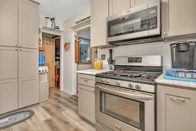 5203 W Court St, Monee, IL 60449 - kitchen featuring appliances with stainless steel finishes, light wood-style floors, and light countertops