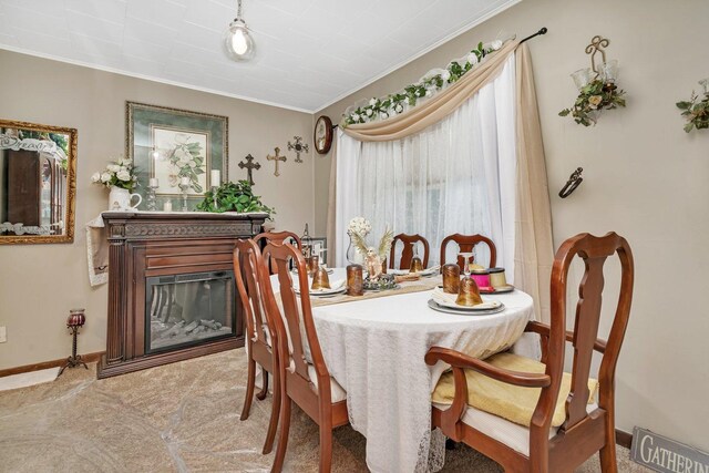5203 W Court St, Monee, IL 60449 - dining area featuring crown molding, carpet flooring, baseboards, and a glass covered fireplace