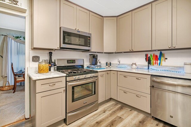 5203 W Court St, Monee, IL 60449 - kitchen featuring stainless steel appliances, light countertops, light wood-style floors, and gray cabinetry