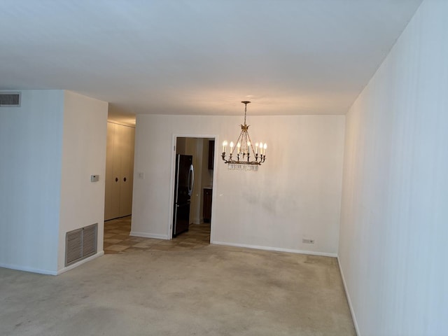 6007 N Sheridan Rd Unit 24H, Chicago, IL 60660 - empty room featuring a chandelier and light colored carpet