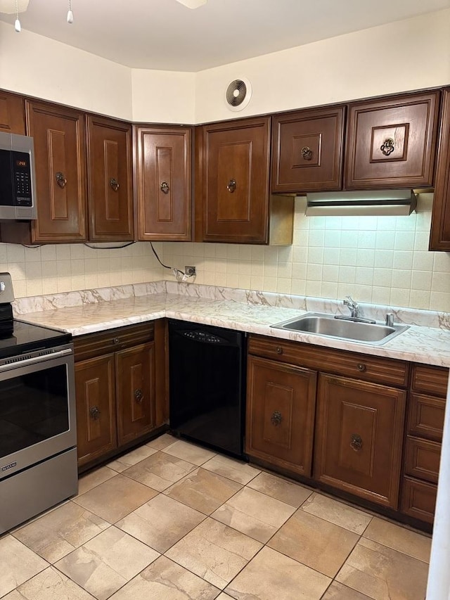 6007 N Sheridan Rd Unit 24H, Chicago, IL 60660 - kitchen with stainless steel appliances, backsplash, and dark brown cabinets