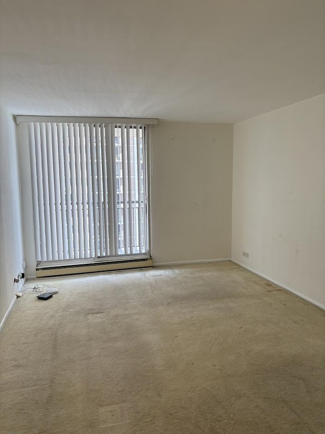 6007 N Sheridan Rd Unit 24H, Chicago, IL 60660 - carpeted spare room with a baseboard heating unit and baseboards