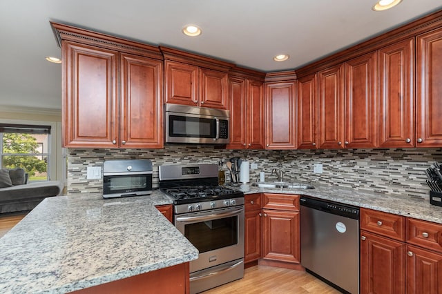1262 N Kennedy Dr, Streamwood, IL 60107 - kitchen with appliances with stainless steel finishes, light wood-style flooring, light stone counters, decorative backsplash, and recessed lighting