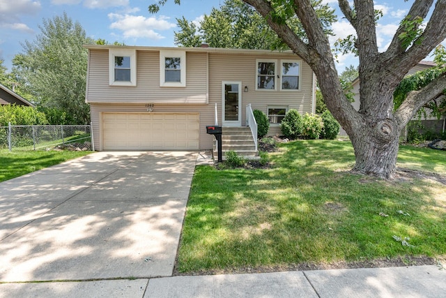 1262 N Kennedy Dr, Streamwood, IL 60107 - split foyer home featuring an attached garage and concrete driveway