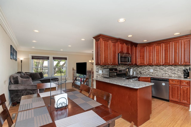 1262 N Kennedy Dr, Streamwood, IL 60107 - kitchen with stainless steel appliances, backsplash, light wood-style floors, crown molding, and light stone counters