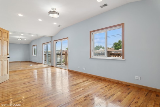7032 W 63rd Pl, Chicago, IL 60638 - spare room with vaulted ceiling, light wood-style floors, and recessed lighting
