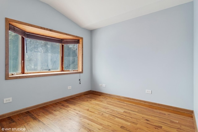 7032 W 63rd Pl, Chicago, IL 60638 - spare room featuring light wood-style floors and lofted ceiling