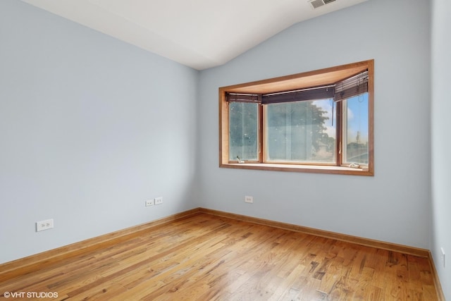 7032 W 63rd Pl, Chicago, IL 60638 - empty room featuring lofted ceiling and wood finished floors