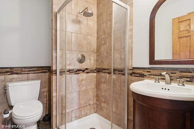 7032 W 63rd Pl, Chicago, IL 60638 - full bathroom with tile walls, a shower stall, vanity, and wainscoting