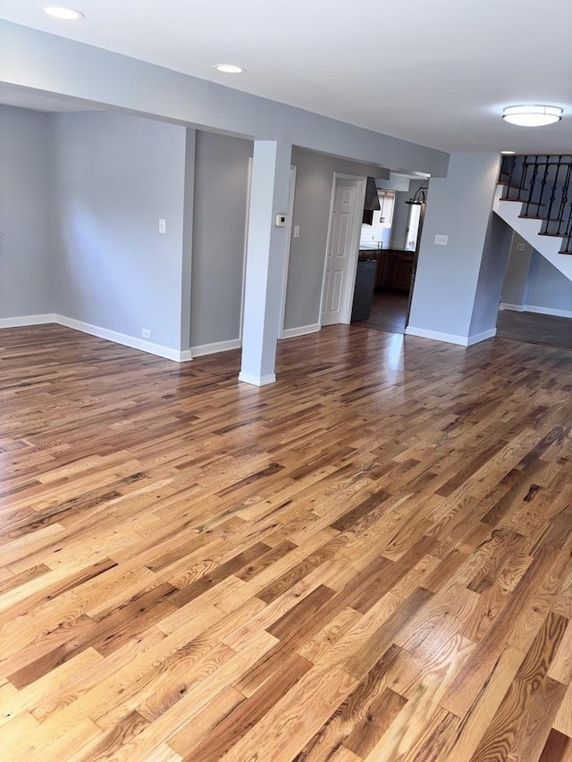 7032 W 63rd Pl, Chicago, IL 60638 - unfurnished living room with wood finished floors and stairway