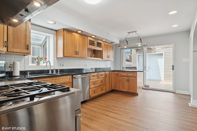 7032 W 63rd Pl, Chicago, IL 60638 - kitchen featuring stainless steel dishwasher, a peninsula, light wood-type flooring, decorative backsplash, and recessed lighting