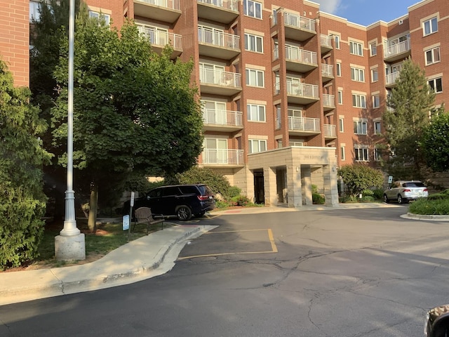 6560 W Diversey Ave Unit 417, Chicago, IL 60707 - view of apartment building / complex with uncovered parking