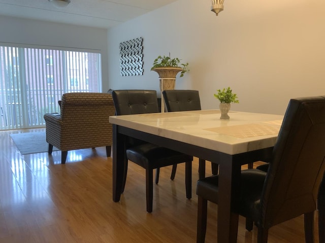 6560 W Diversey Ave Unit 417, Chicago, IL 60707 - dining room featuring light wood-type flooring