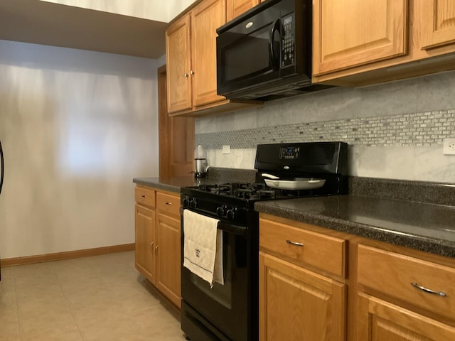 6560 W Diversey Ave Unit 417, Chicago, IL 60707 - kitchen featuring black appliances, dark countertops, and backsplash