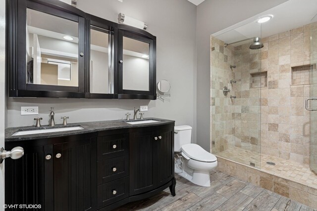 165 N Canal St Unit 1231, Chicago, IL 60606 - full bathroom featuring a stall shower, double vanity, and wood finished floors